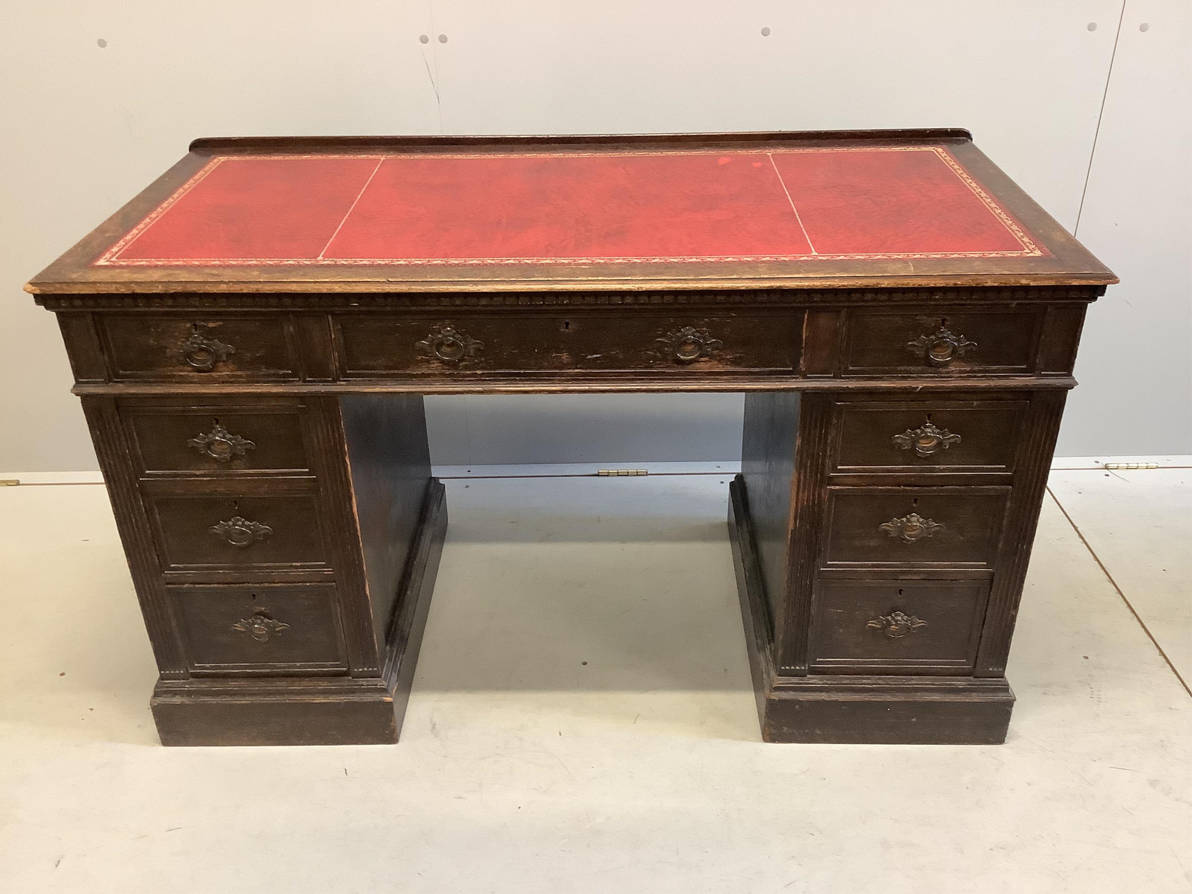 A late Victorian oak pedestal desk, width 128cm, depth 61cm, height 77cm. Condition - fair